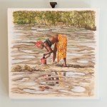 Digging for Mussels. A Gambian woman hard at work in the Mangrove Forest.